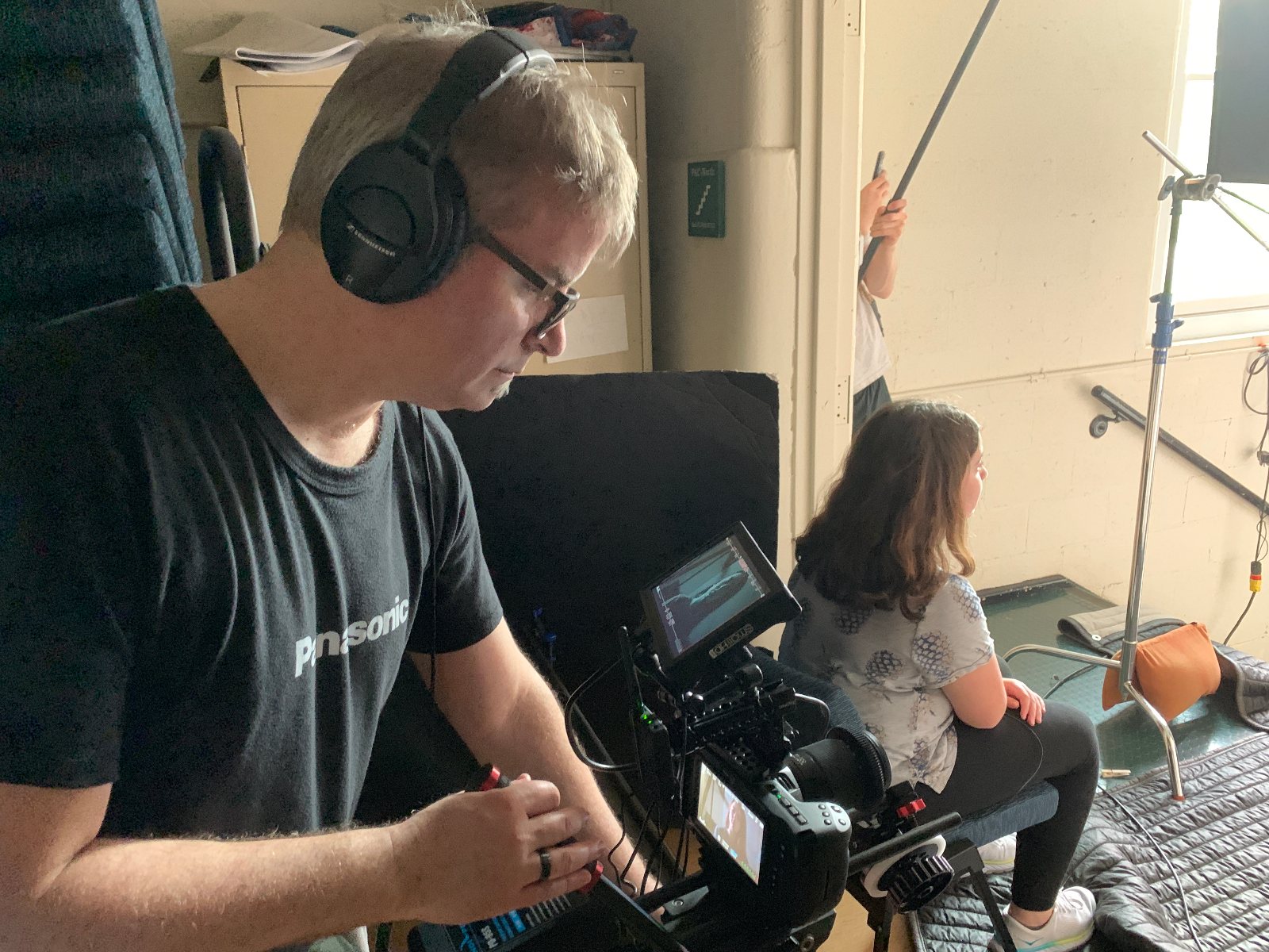 David Tarleton filming a young actor with a student boom operator on a Kids Matter shoot
