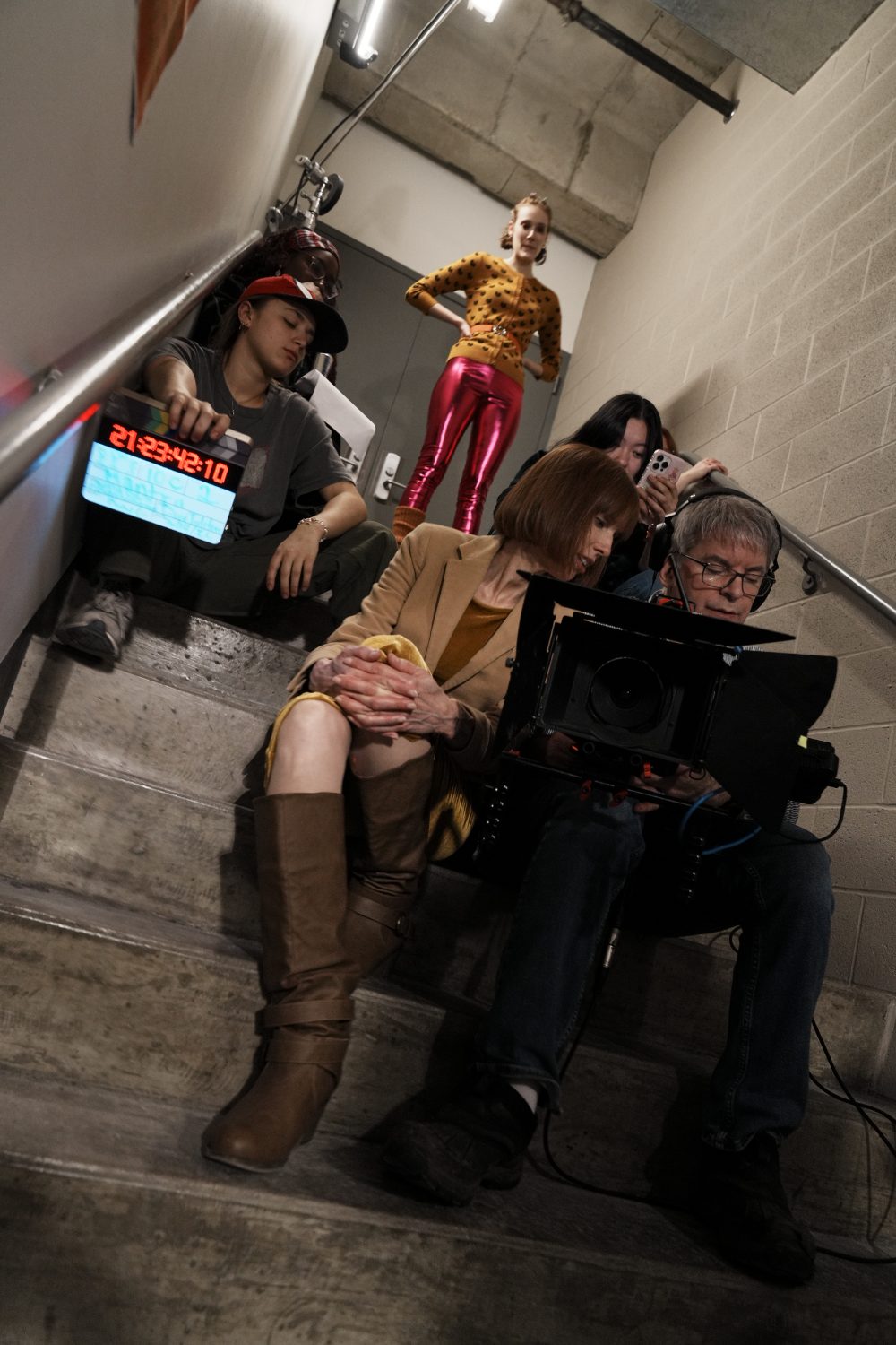 At the monitor with the student crew on the set of Mantra