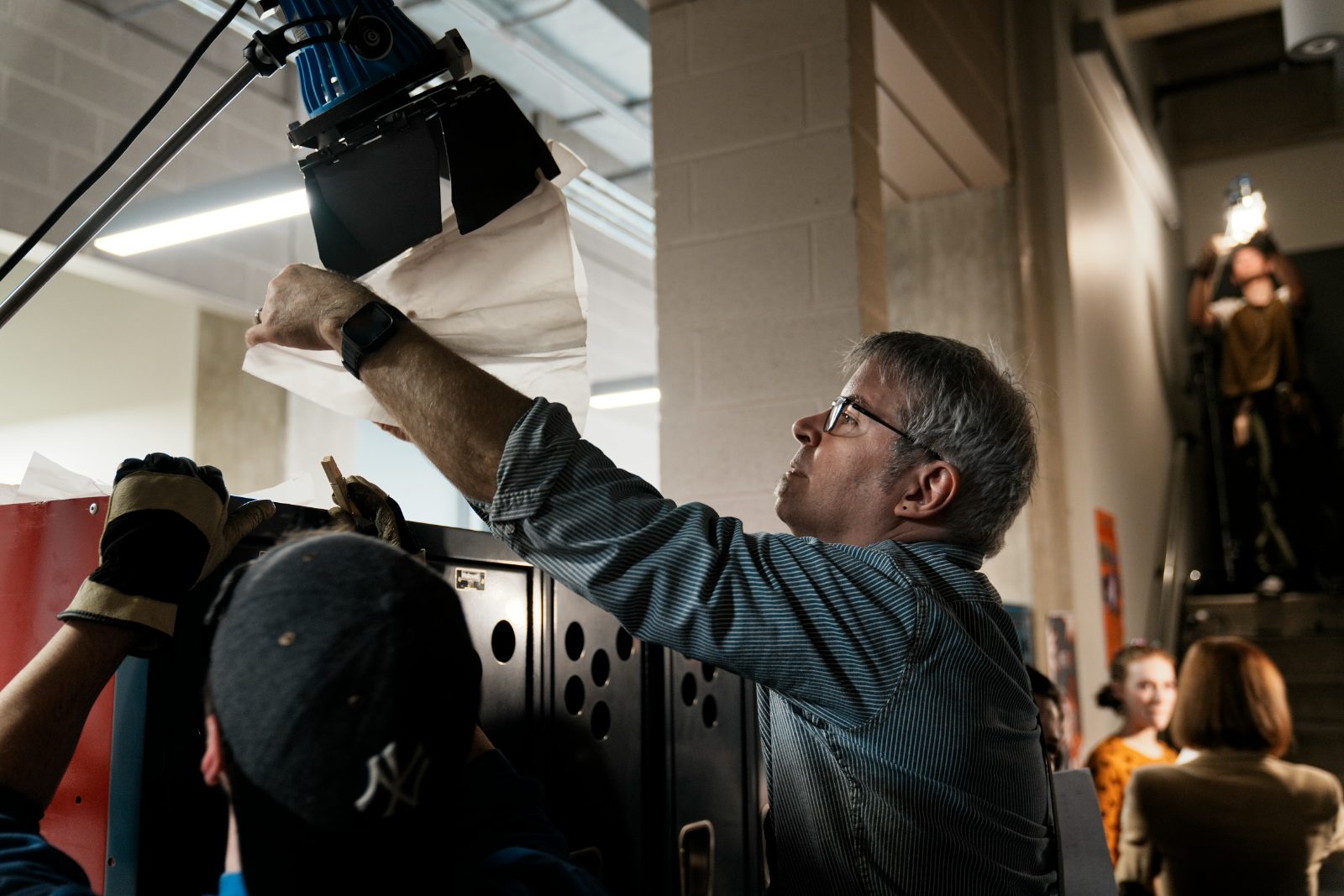 David Tarleton setting a light on the set of Mantra