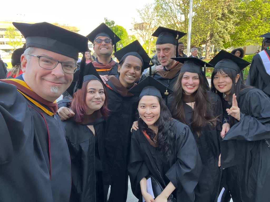 David Tarleton with graduating graduate students at commencement